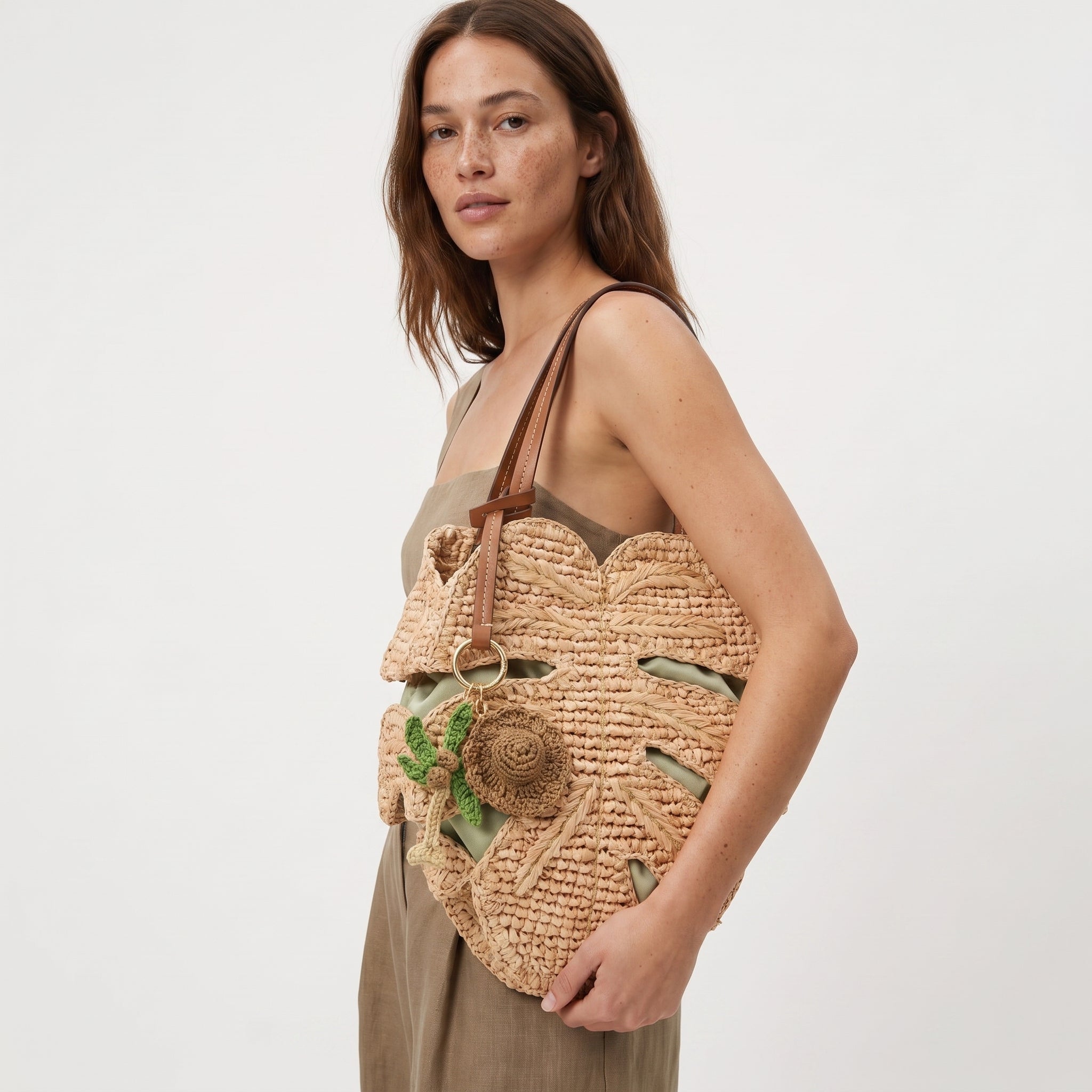 Monstera raffia tote bag resort lifestyle close view