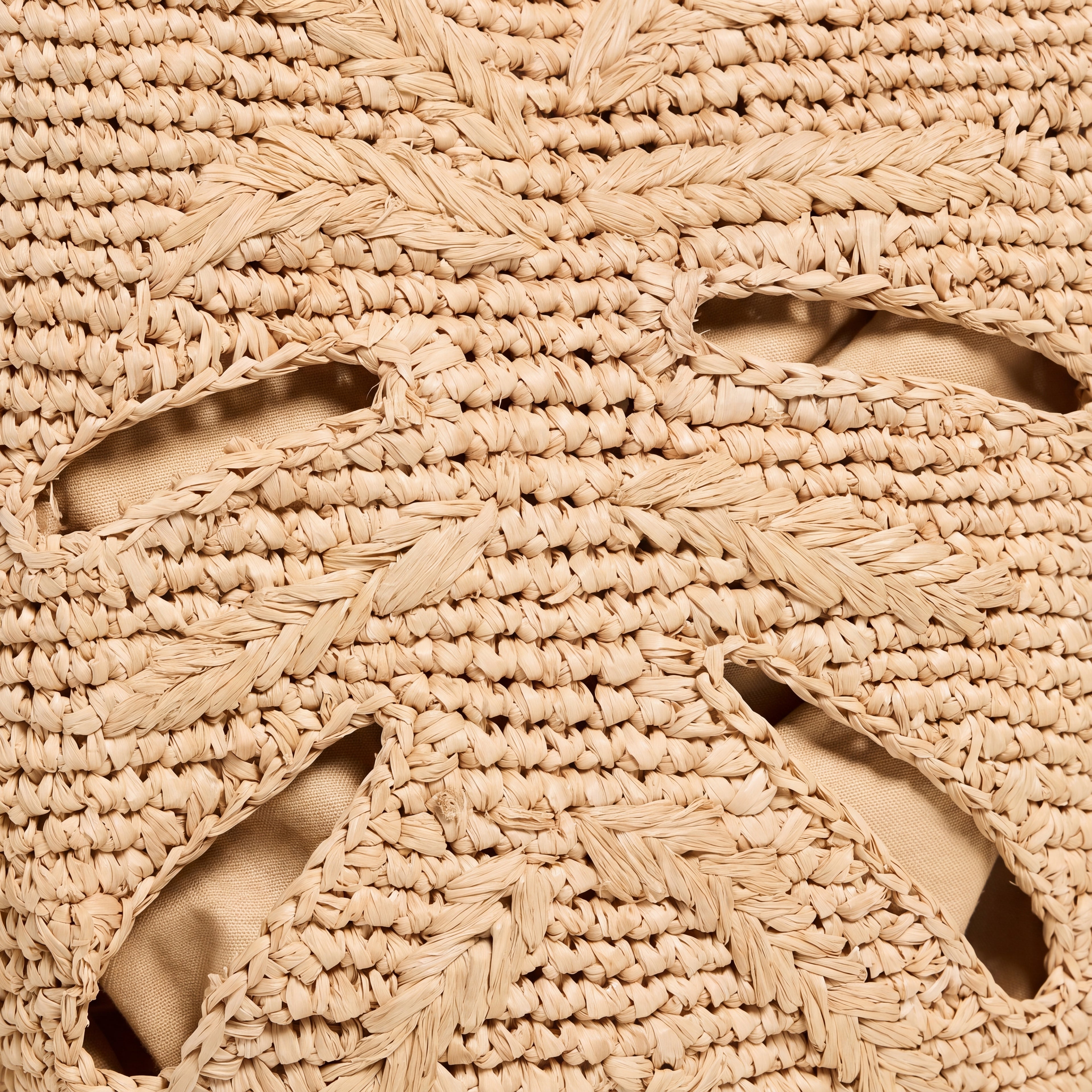 Close-up of hand-crocheted paper raffia Monstera texture