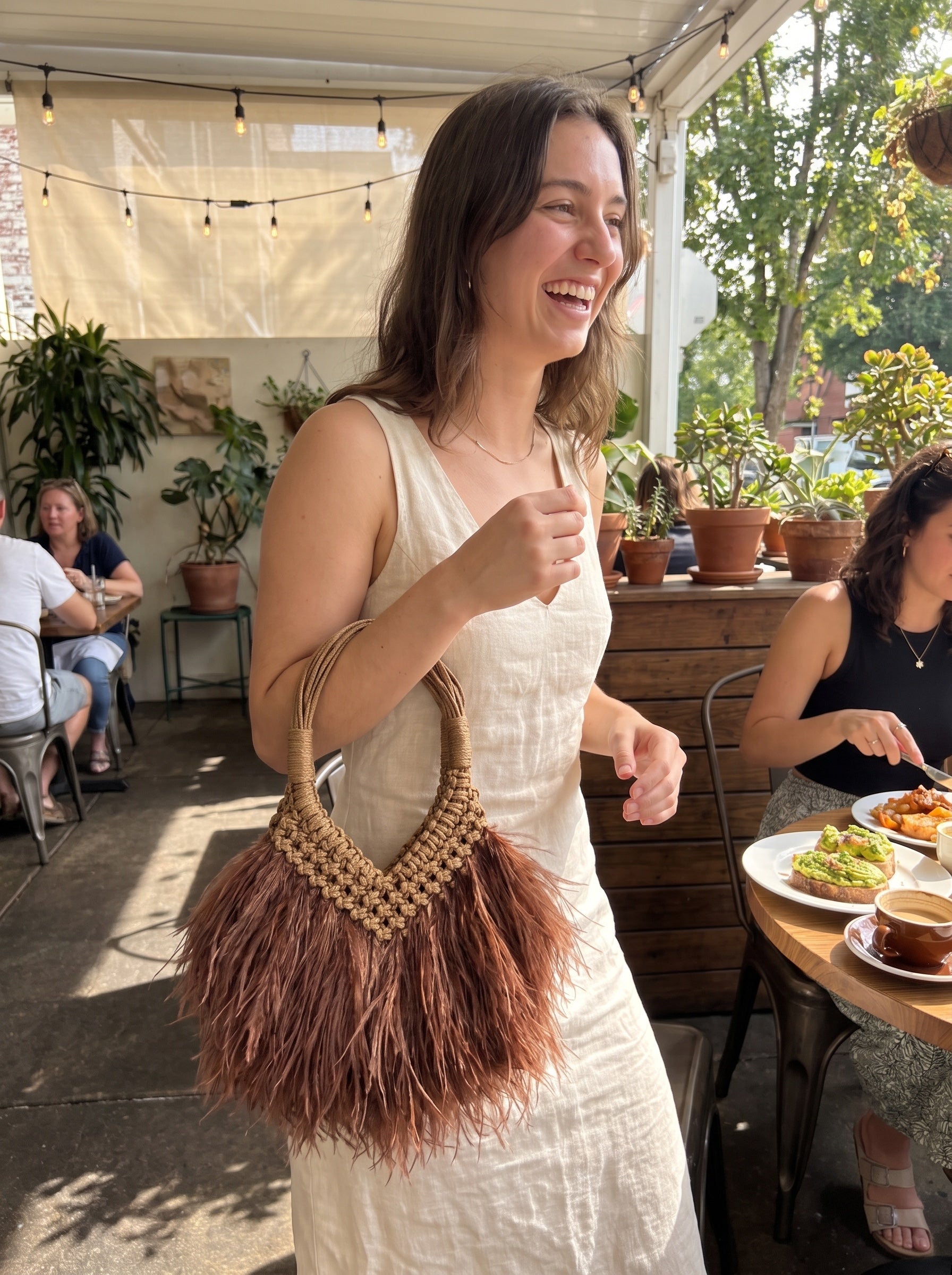 Chocolate brown feather bag styled for brunch