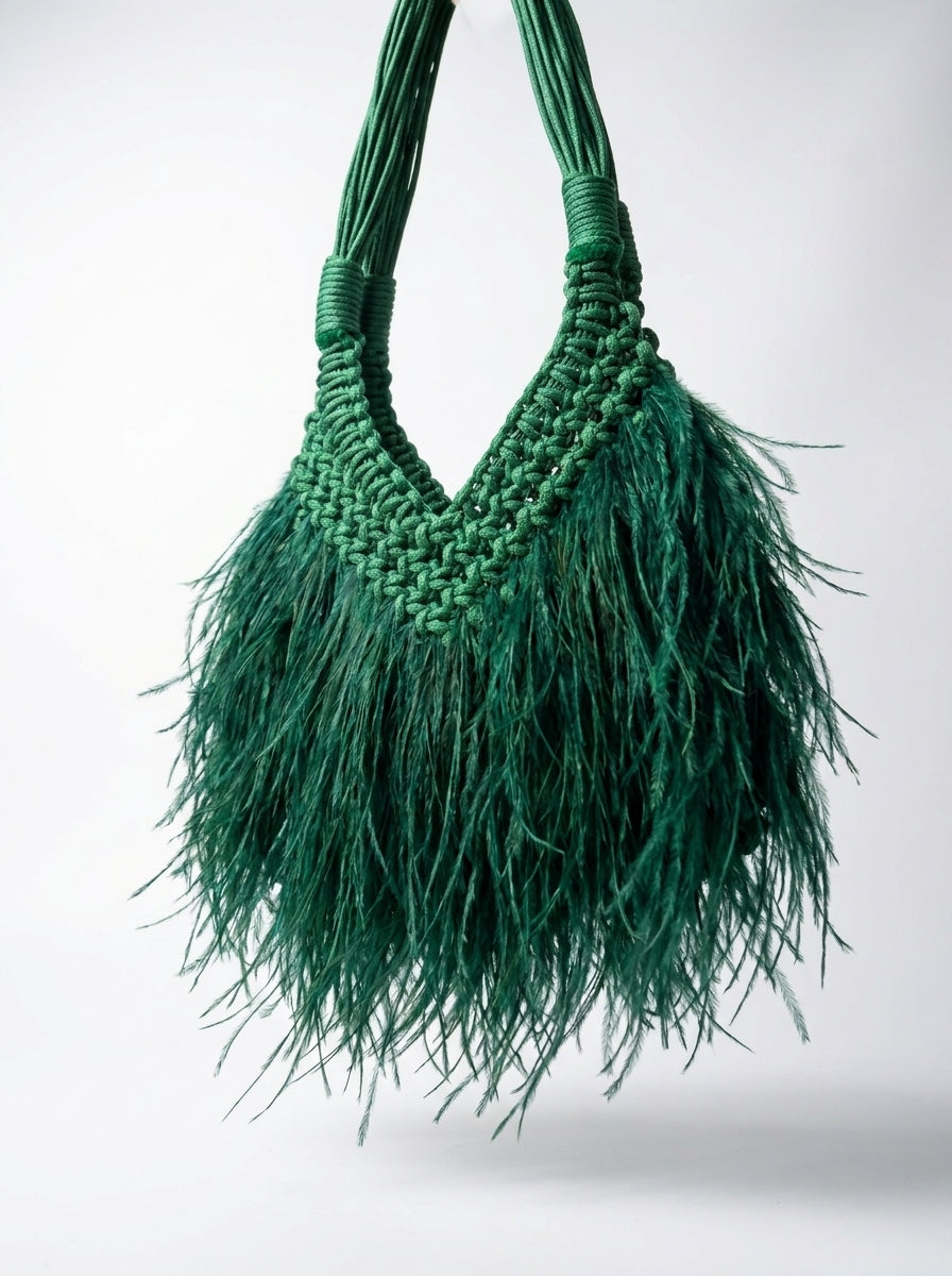 Close-up of green macrame knotting and ostrich-look feathers